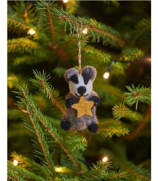 Bertie the Badger Holding a Star Christmas Decoration